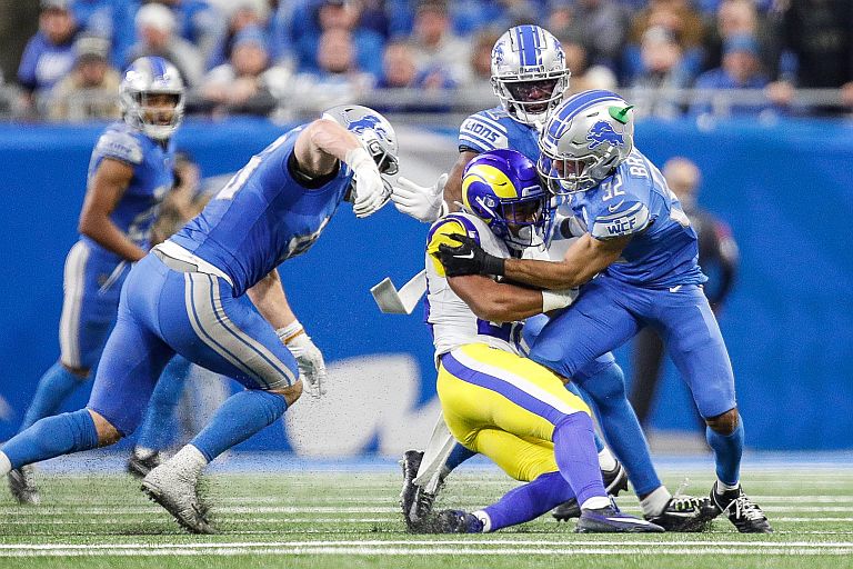 Detroit Lions safety Brian Branch (32) tackles L.A. Rams running back Ronnie Rivers (20) during the second half of their NFL wild-card playoff game