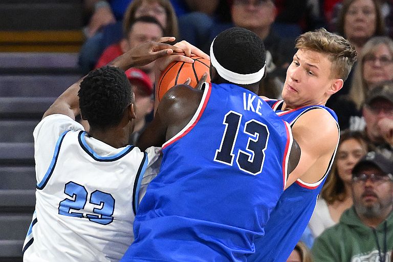 Gonzaga Bulldogs forward Ben Gregg, right and Gonzaga Bulldogs forward Graham Ike (13) fights for the ball against San Diego Toreros guard Emmanuel Callas