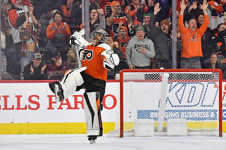 Philadelphia Flyers goaltender Samuel Ersson celebrates after making the final save during the shootout in win against the Montreal Canadiens