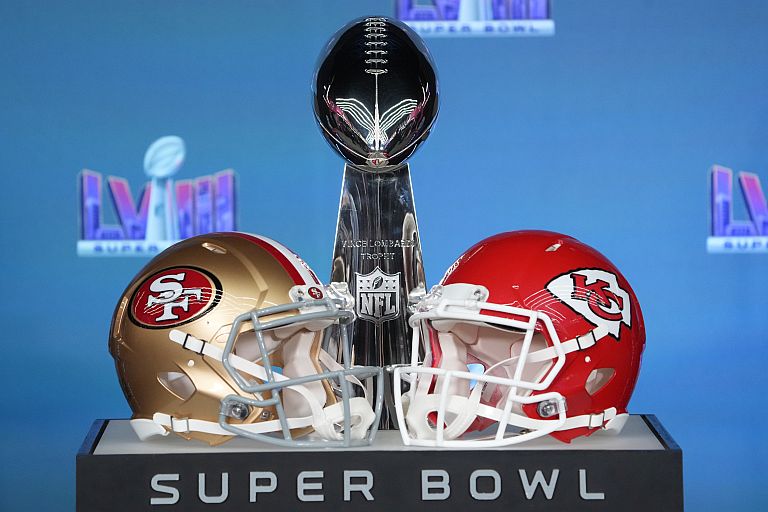 Helmets for the San Francisco 49ers and Kansas City Chiefs on display with the Vince Lombardi Trophy