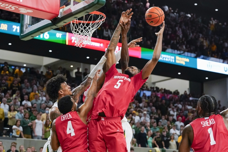 Houston Cougars forward Ja'Vier Francis (5) grabs the rebound during overtime against the Baylor Bears