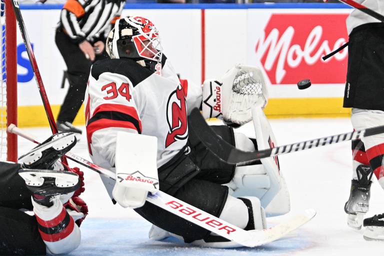 New Jersey Devils goalie Jake Allen (34) makes a save against the Toronto Maple Leafs