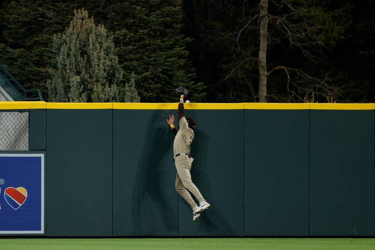 San Diego Padres center fielder Jackson Merrill (3) is unable to make a catch on a Colorado Rockies home run