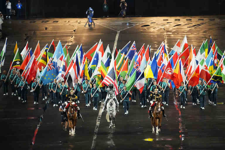 Jul 26, 2024; Paris, FRANCE; The Olympic flag is carried into the Trocadero by Floriane Issert during the Opening Ceremony for the Paris 2024 Olympic Summer Games along the Seine River. Mandatory Credit: Rob Schumacher-USA TODAY Sports