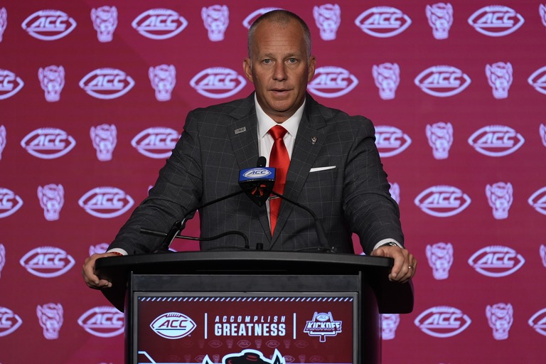 Jul 25, 2024; Charlotte, NC, USA; North Carolina State Wolfpack head coach Dave Doeren speaks to the media during the ACC Kickoff at Hilton Charlotte Uptown. Mandatory Credit: Jim Dedmon-USA TODAY Sports